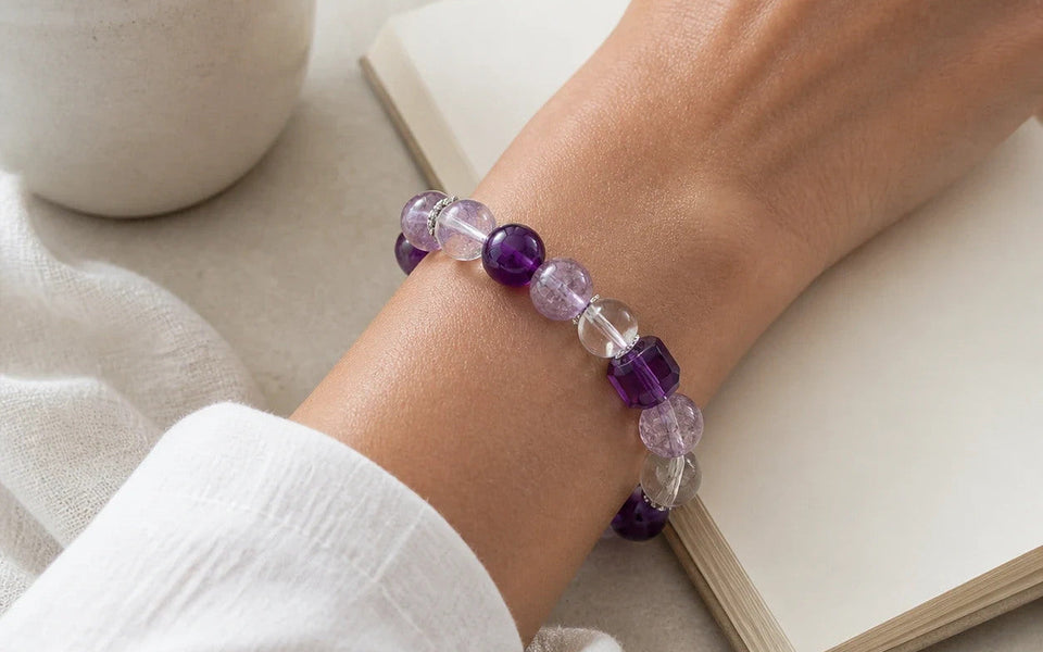 Dream Ritual Bracelet worn at the wrist beside an open book