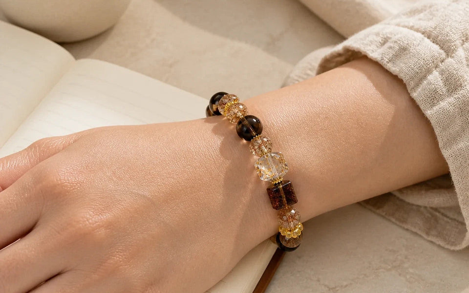 Power Ritual Bracelet worn at the wrist beside an open notebook