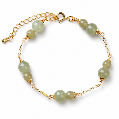 Pale green bead bracelet with gold-tone chain details