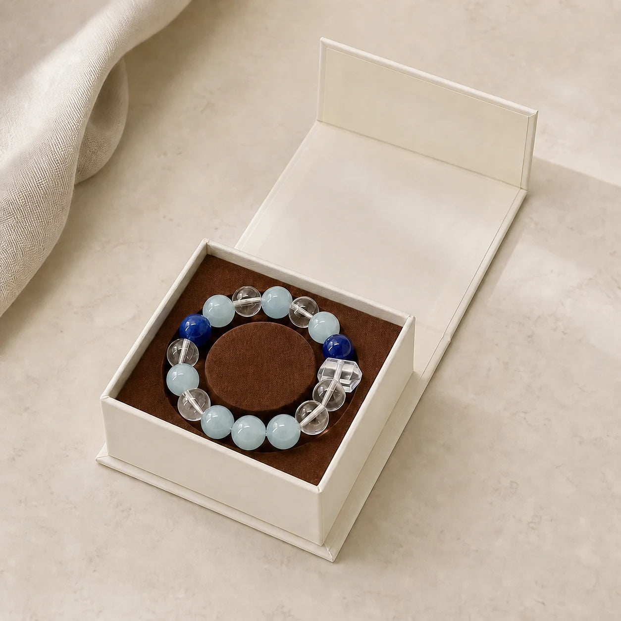 Calm Ritual Bracelet arranged inside an open ivory jewelry box