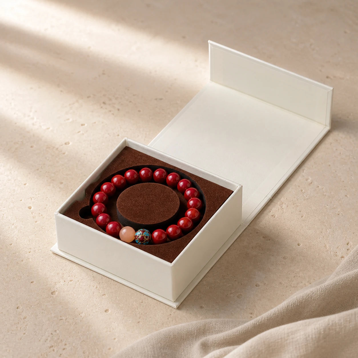 Courage Ritual Bracelet arranged inside an open ivory jewelry box