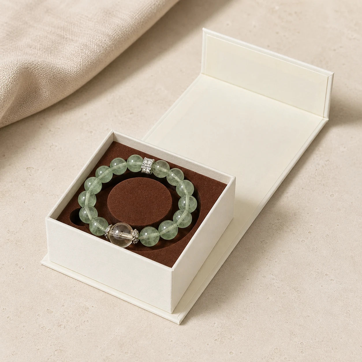 Growth Ritual Bracelet arranged inside an open ivory jewelry box