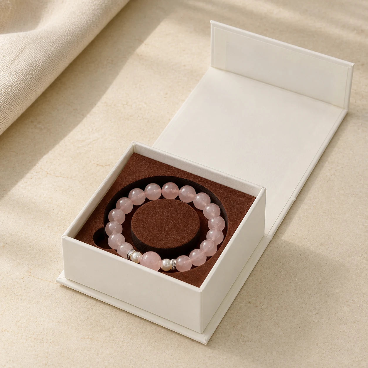 Love Ritual Bracelet arranged inside an open ivory jewelry box