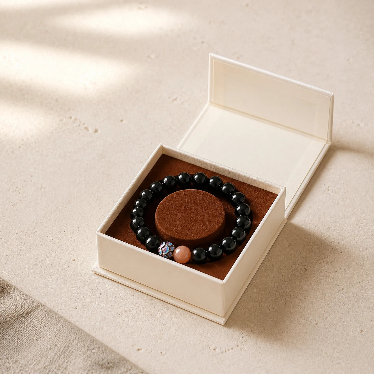 Protection Ritual Bracelet arranged inside an open ivory jewelry box